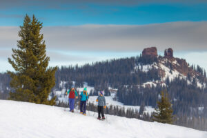 Family Snowshoeing on Steamboat Mountain during winter