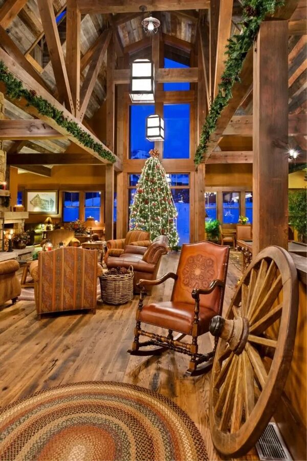 The Barn clubhouse interior with timber beams, a great room and holiday tree